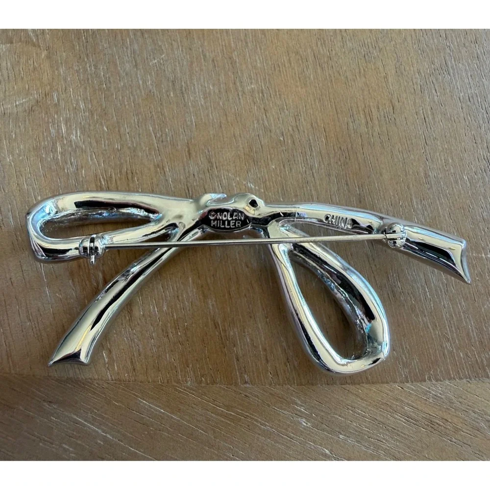 Nolan Miller Glamour Collection Forget Me Not Baguette Bow Pin Brooch